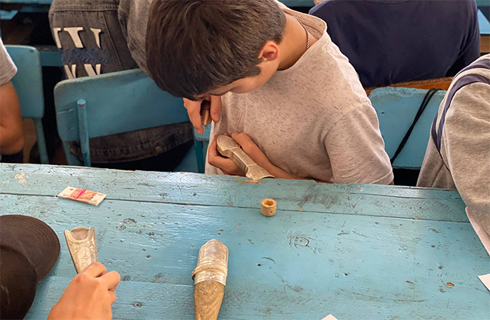 Children learning Kubachi art