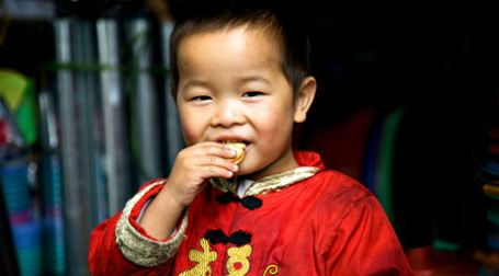 Мальчик в китайской национальной одежде. Фото: Szymon Kochański/flickr.com