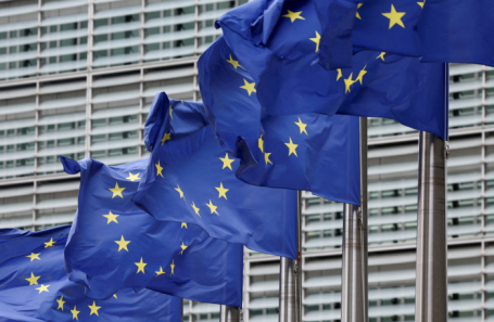 A photo representing EU leaders discussing policy, hinting at sanctions.