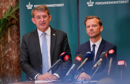 Danish press conference discussing drone incidents near airports.
