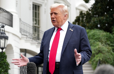 Donald Trump speaking at a podium
