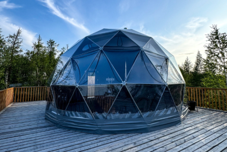 A serene glamping site, exemplifying the trend of wellness and sleep tourism among youth.