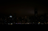 Вид на Центральный финансовый район Гонконга после выключения света в честь Часа Земли.
