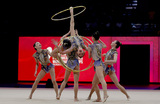 Сборная Китая впервые завоевала золото чемпионата мира по художественной гимнастике, выиграв групповые упражнения с пятью обручами в Валенсии.