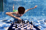 Подводный чемпионат по шахматам в Кейптауне. ЮАР. На фото: гроссмейтер из Узбекистана Жавохир Синдаров против Ханса Ниманна (США). 