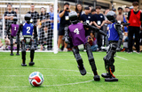 Футбольный матч международного чемпионата человекоподобных роботов RoboCup 2026 между командами «Гефест» Университета Цинхуа и командой «Горы и моря» Китайского сельскохозяйственного университета. Инчхон, Южная Корея.